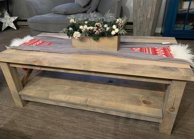 Rustic whitewashed coffee table with a lower shelf