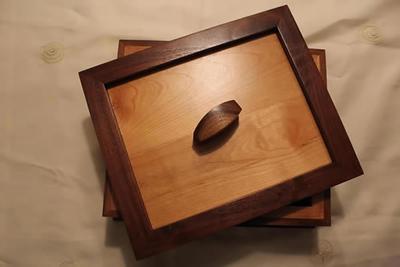 Keepsake box with a light lid and dark walnut frame