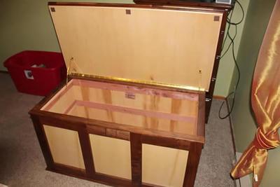 The maple and black walnut chest with the lid open