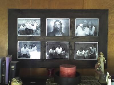 Large black multi-picture frame holding six photos