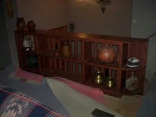 Wood shelving unit used as a banister