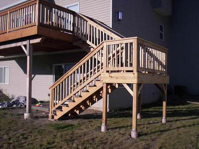 Two-story deck with wood stairs and railings